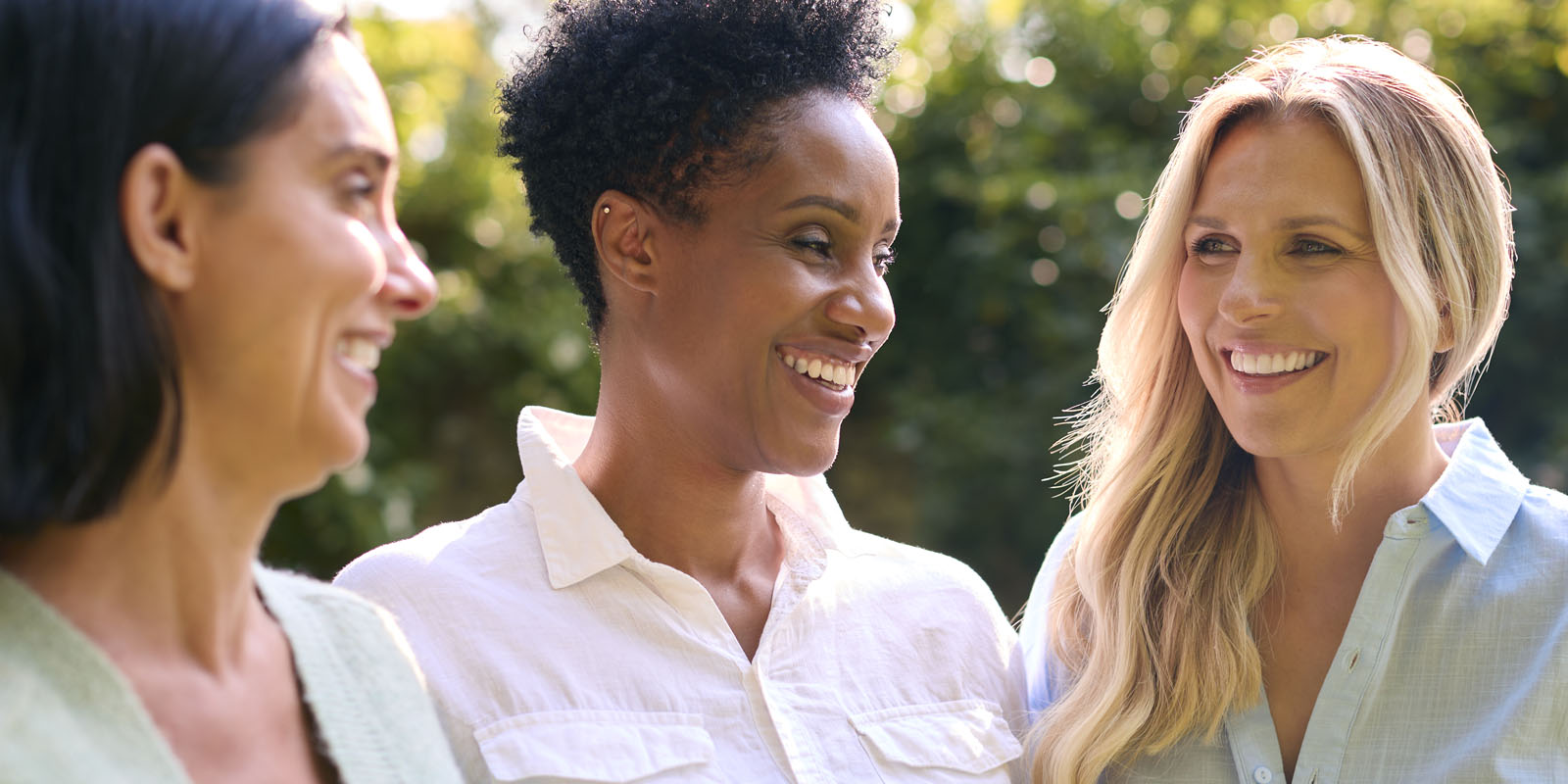 Mature friend group laughing