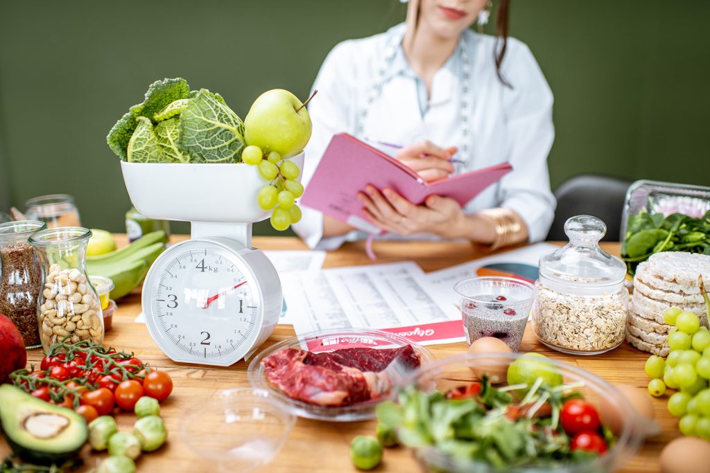 Dietitian with healthy food in the office